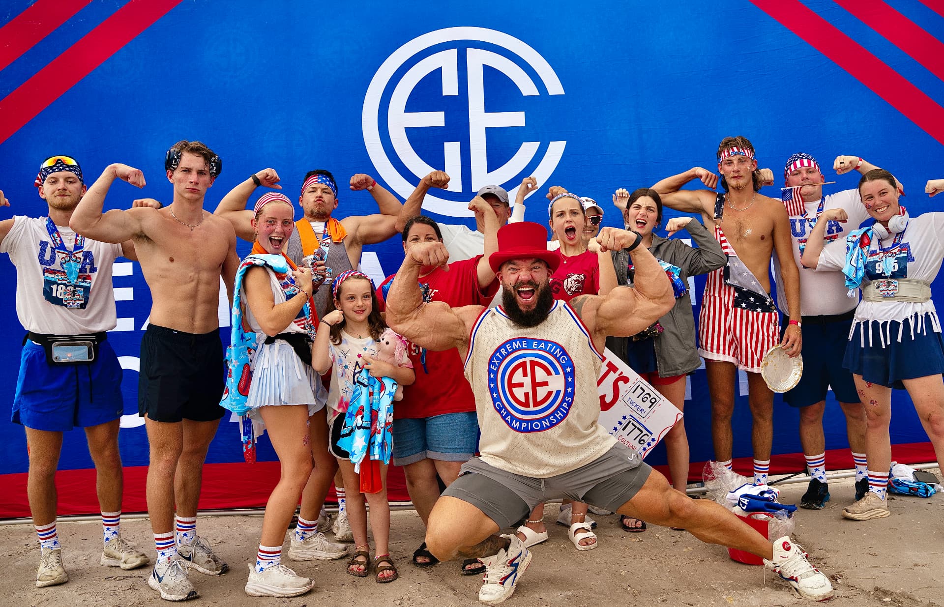 EEC community members flexing together in patriotic gear at an EEC event